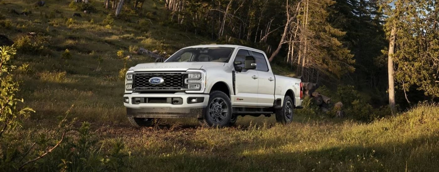 White 2024 Ford F-350 Lariat Sport parked off-road